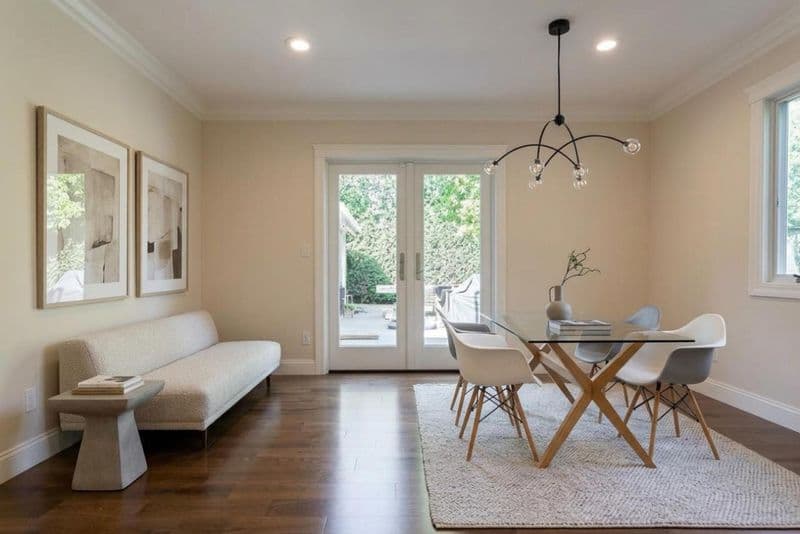 living room after: French doors opening to backyard patio with hardwood flooring and painted drywall, by ASL Remodeling, Menlo Park.