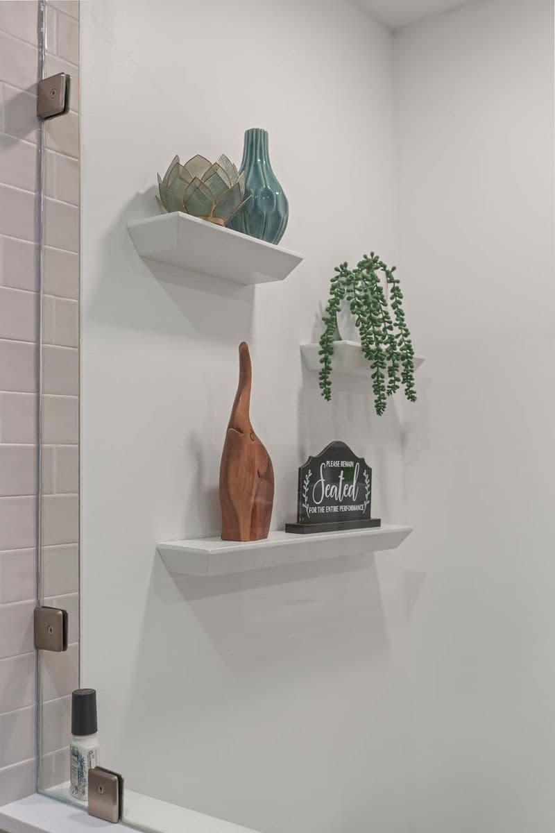 bathroom after: white floating shelves with decor with painted drywall and white floating shelves, by ASL Remodeling, Pacifica.