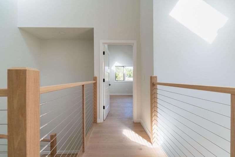 Los Gatos home on Vista Del Mar with upstairs hallway, modern cable railing, engineered white oak hardwood flooring, and natural light