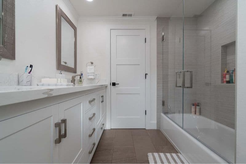 San Jose bathroom on Crossmont Circle with vanity, frameless glass enclosure, recessed niches, and spa-inspired tilework