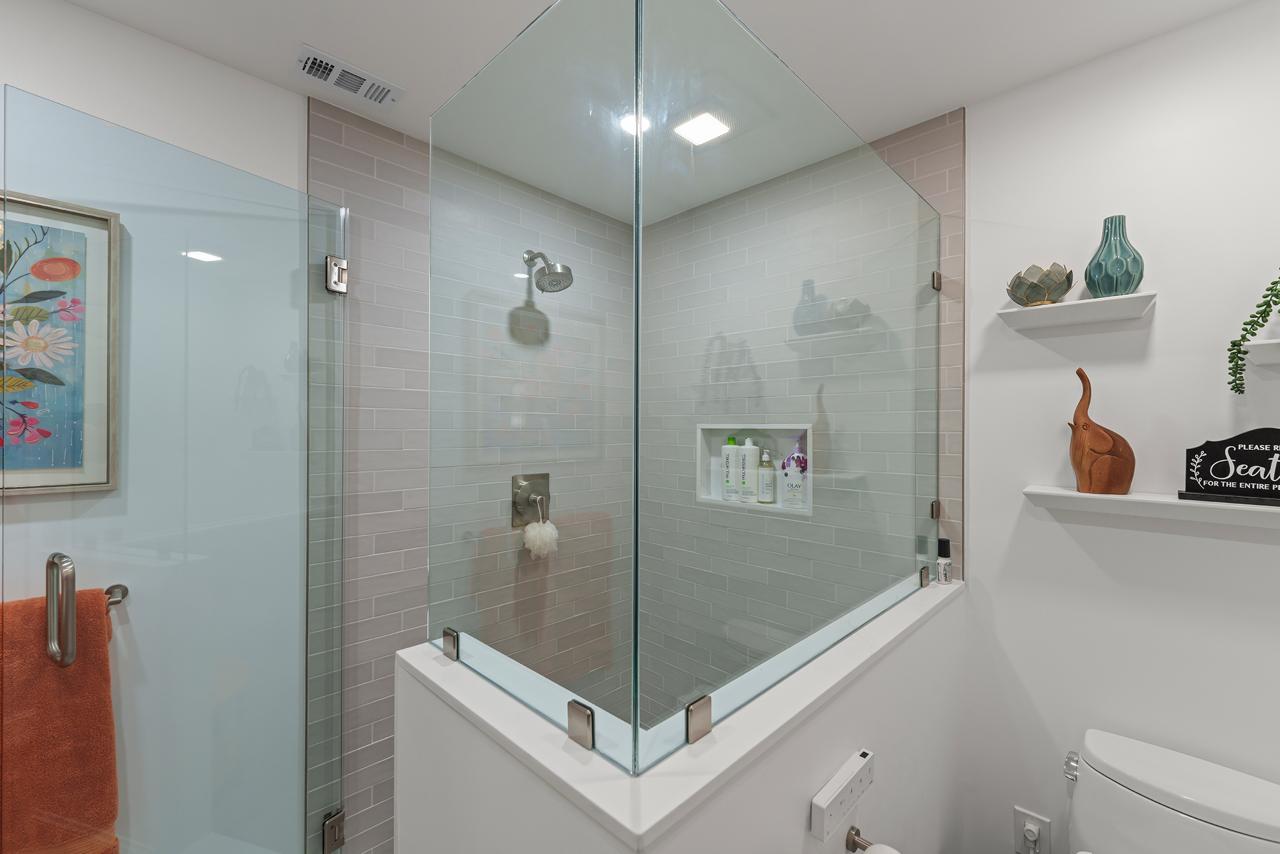 bathroom after: frameless glass enclosed walk in shower with gray subway tile and frameless tempered glass, by ASL Remodeling, Pacifica.