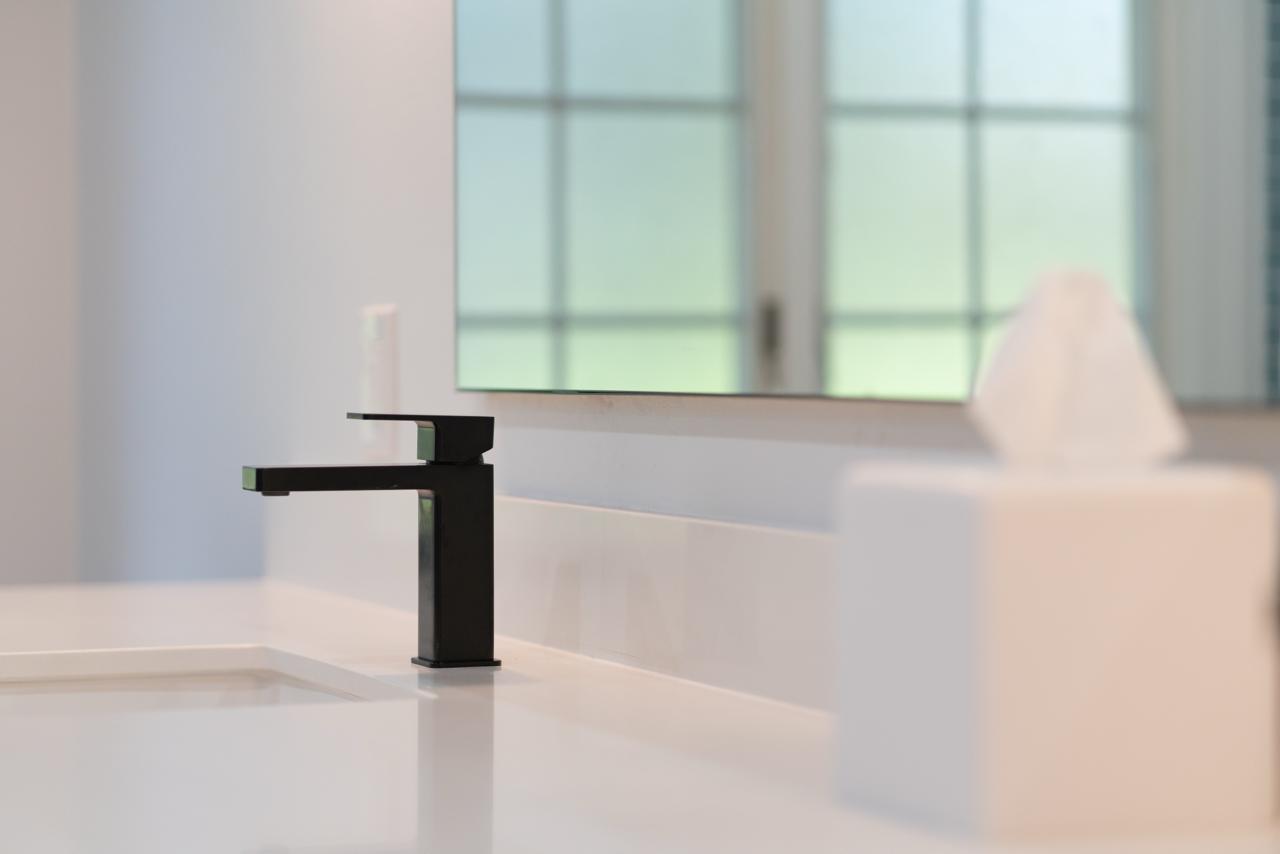 bathroom: matte black square single handle faucet with matte black metal and white quartz countertop, by ASL Remodeling, Monte Sereno.