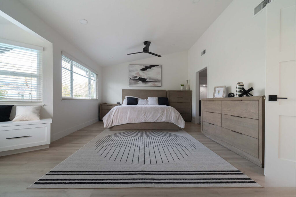 Custom home remodeling San Francisco bedroom with trimless recessed lighting and wood slat accent wall in minimalist style