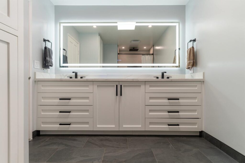Professional bathroom remodeling services in Los Gatos with white double vanity, marble countertops, and contemporary styling