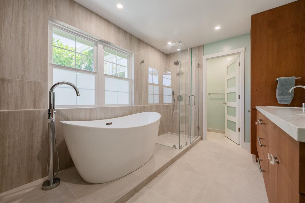 Spa-inspired bathroom with a freestanding tub and frameless glass walk-in shower completed by Los Gatos bathroom remodel contractors.