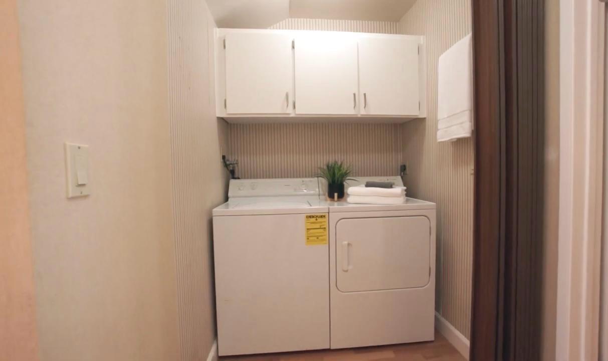 Before laundry room on Central Ave in Mountain View with side-by-side washer and dryer prior to custom cabinetry upgrade