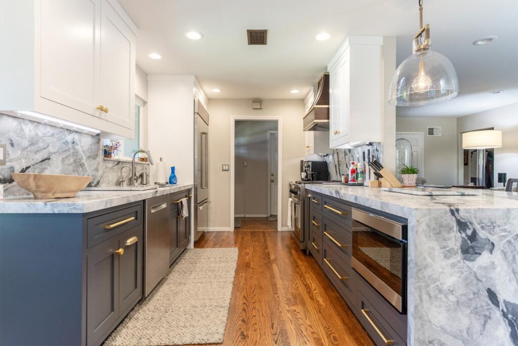 Sophisticated two-tone kitchen with custom cabinetry featuring built-in wine storage and hardwood finishes