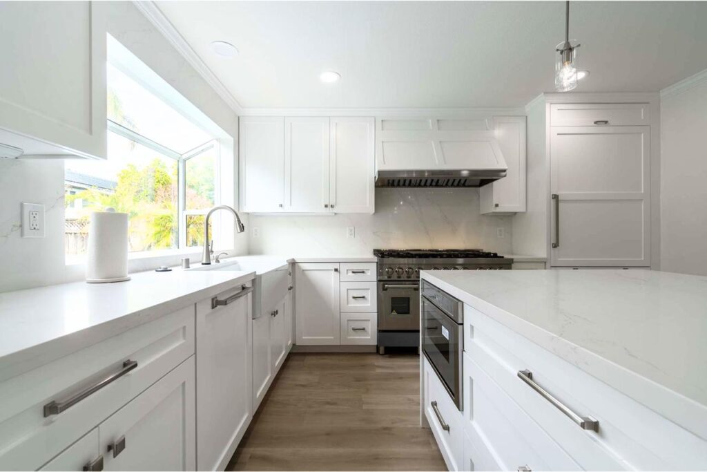 Crossmont Circle kitchen in San Jose with panel-ready Thermador appliances, full slab quartzite backsplash, and white oak hardwood flooring