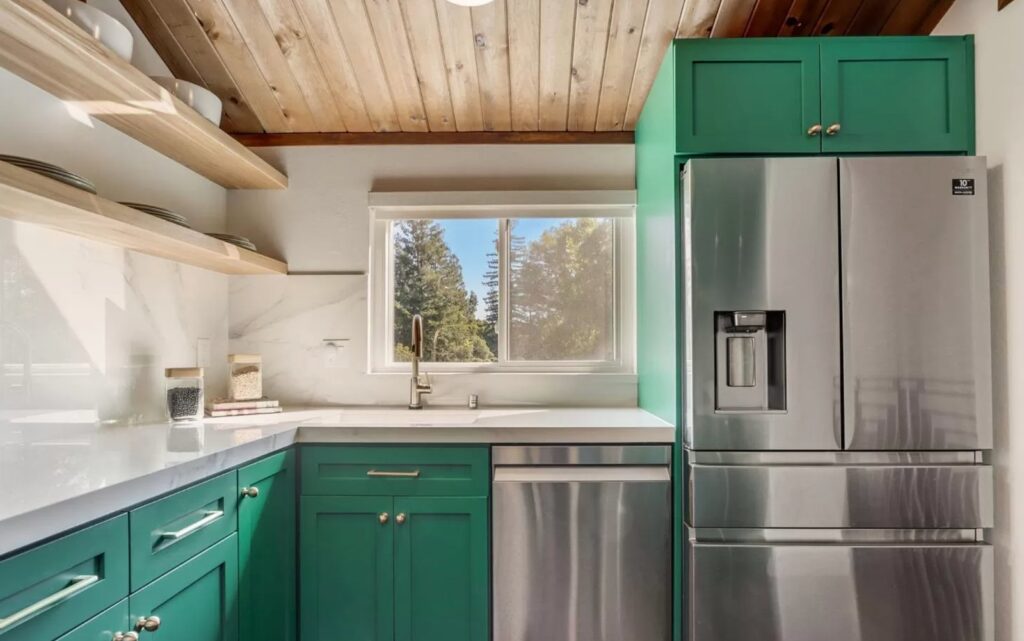 Mountain View kitchen on Central Ave with custom green maple cabinetry, wood ceiling with exposed beams, open shelving, and stainless appliances