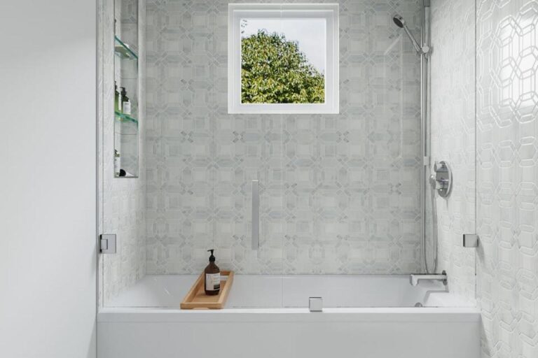 Marble bathroom installation 3D design visualization for Santa Clara featuring natural marble wall tile, modern freestanding bathtub, white floating vanity, and natural window lighting with pendant fixtures