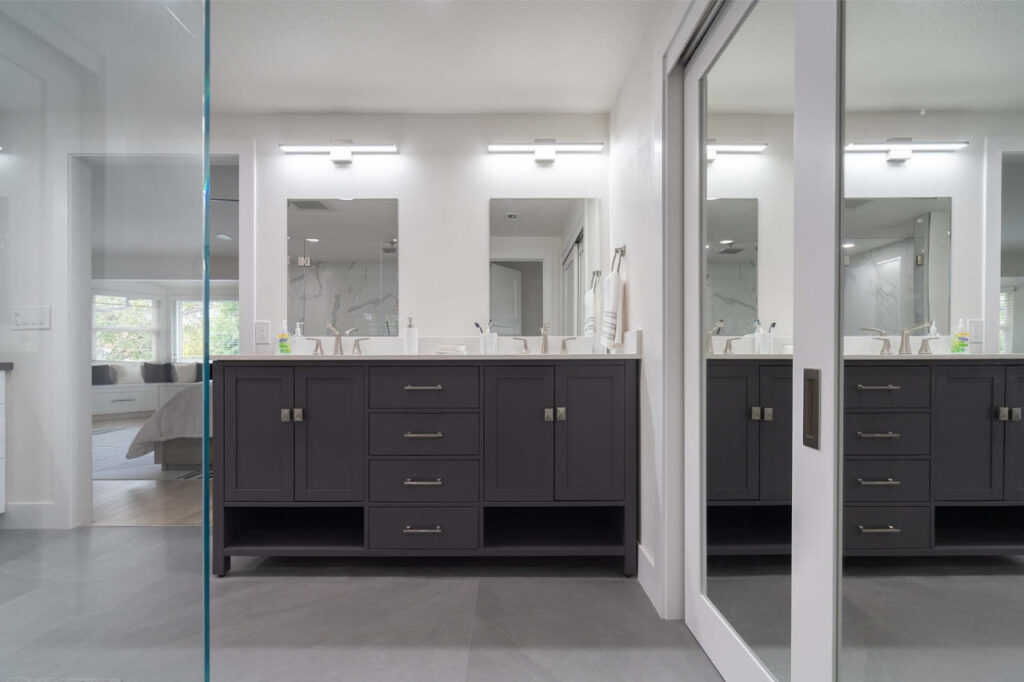 Quartz countertops on floating vanity in San Francisco bathroom with white tile and modern fixtures by ASL Remodeling
