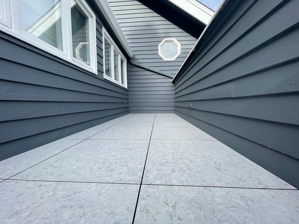 Vista Del Mar home remodel featuring balcony resurfacing with floating tile system over CIM 1000 waterproofing membrane for long-term durability by ASL Remodeling in Los Gatos